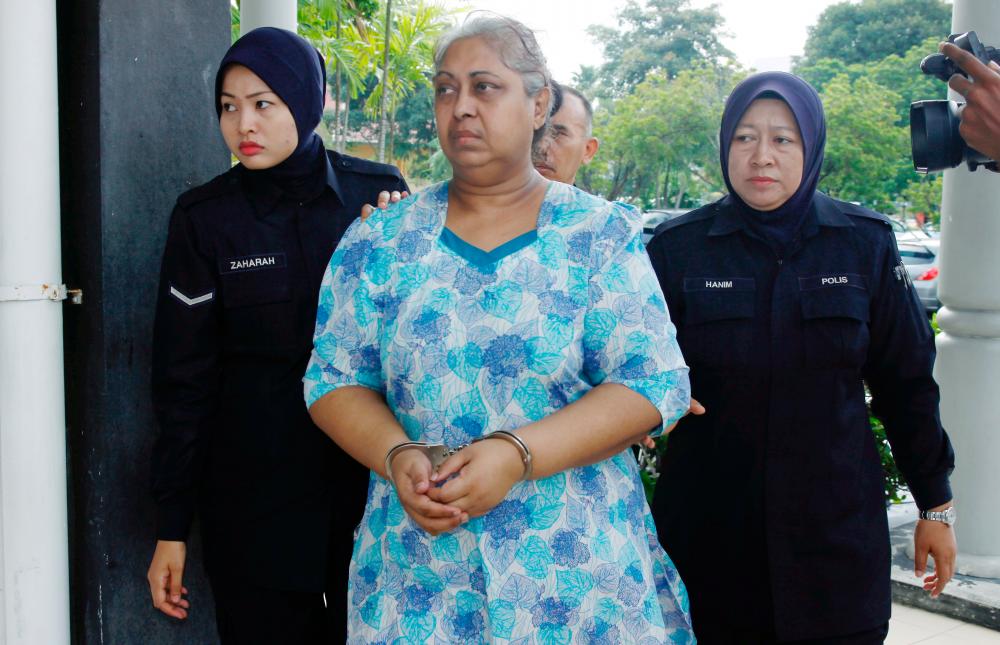 FILE PHOTO: BUKIT MERTAJAM 19 APRIL 2018. M. A. S. Ambika, 60, was escorted by policemen to the Bukit Mertajam Magistrate’s Court for re -mention in connection with the abuse of a 26 -year -old Indonesian woman at her home in Taman Kota Permai 2, Bukit Mertajam, Penang on February 10 2018. BBXpress