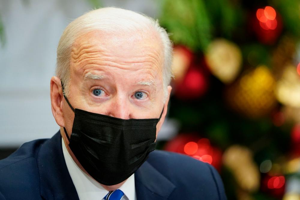 Biden faces defeat on voting rights bill, gets hammered on vaccines