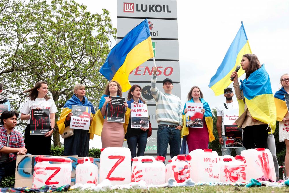 Protestors gather near the Lukoil headquarters to call to boycott the Russian oil company in Brussels on May 13, 2022. AFPpix