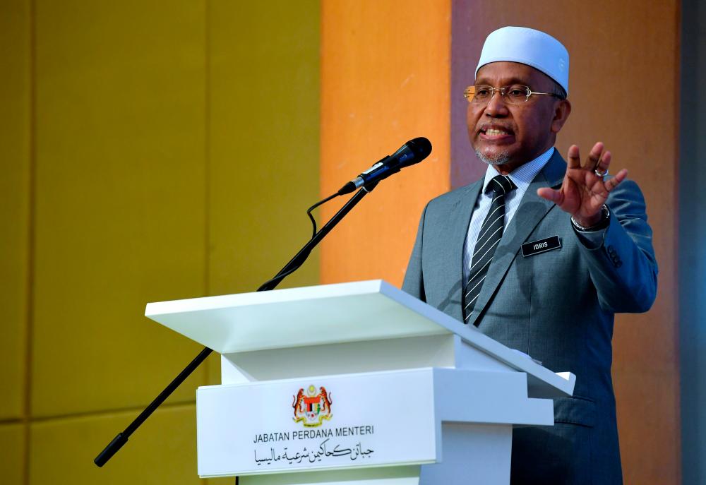 PUTRAJAYA, 10 August -- Minister in the Prime Minister’s Department (Religious Affairs) Datuk Idris Ahmad when speaking at the Inauguration Ceremony of Sulh ‘Outreach Programme’ (Or Sulh) Year 2022 at Dewan Seroja today. BERNAMAPIX