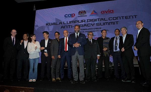 Communications and Multimedia Minister Gobind Singh Deo welcomes guests and panel members at the Kuala Lumpur Digital Content Anti-Piracy Summit in Putrajaya on Feb 14, 2019. — Bernama