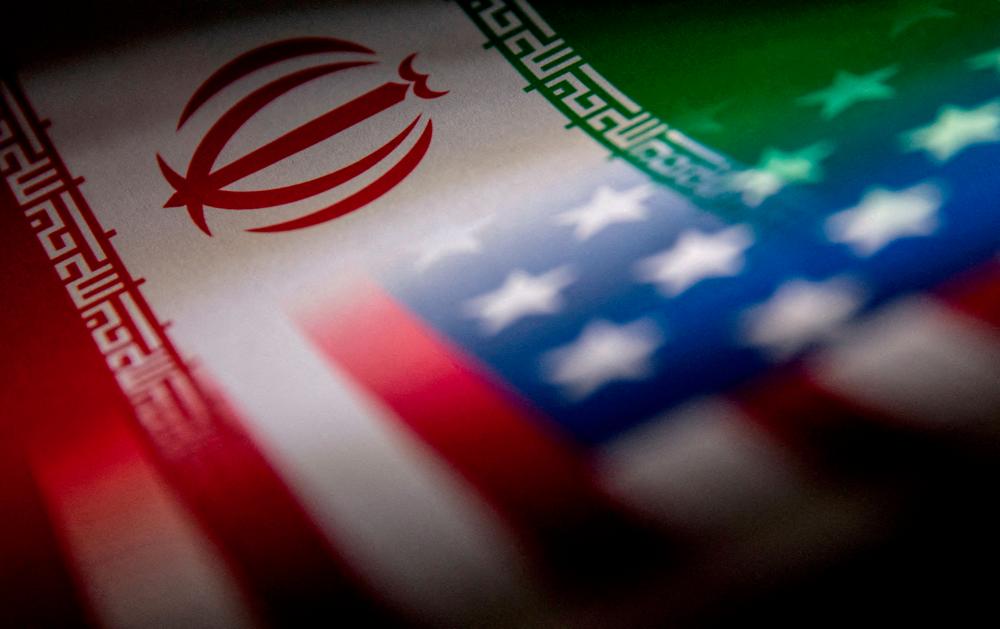 FILE PHOTO: The Iranian and U.S. flags are seen printed on paper in this illustration taken January 27, 2022. REUTERSPIX