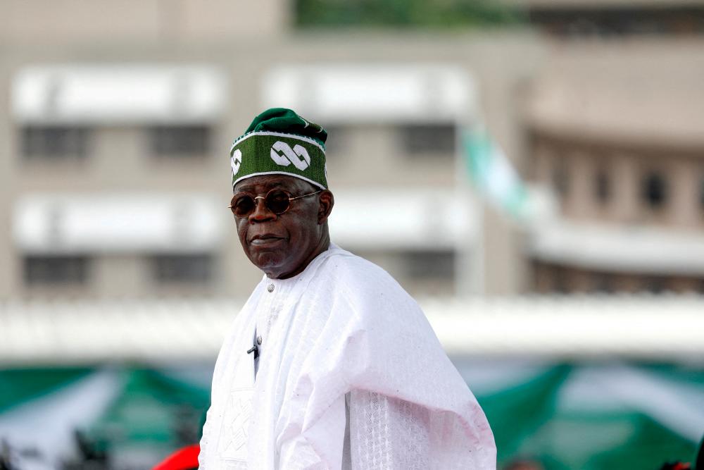 FILE PHOTO: Nigeria's President Bola Tinubu looks on after his swearing-in ceremony in Abuja, Nigeria May 29, 2023. - REUTERSPIX