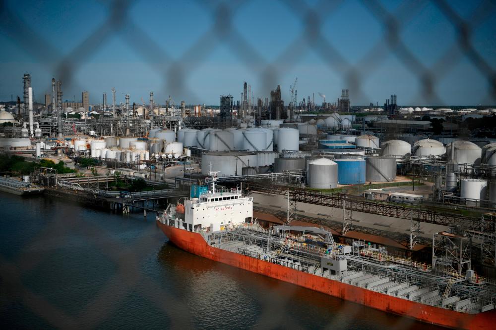 The Houston Ship Channel and adjacent refineries, part of the Port of Houston in Texas. Traders are waiting for news on when market-moving US government oil inventory and other data will be published after it was not released last week due to server issues.– Reuterspix