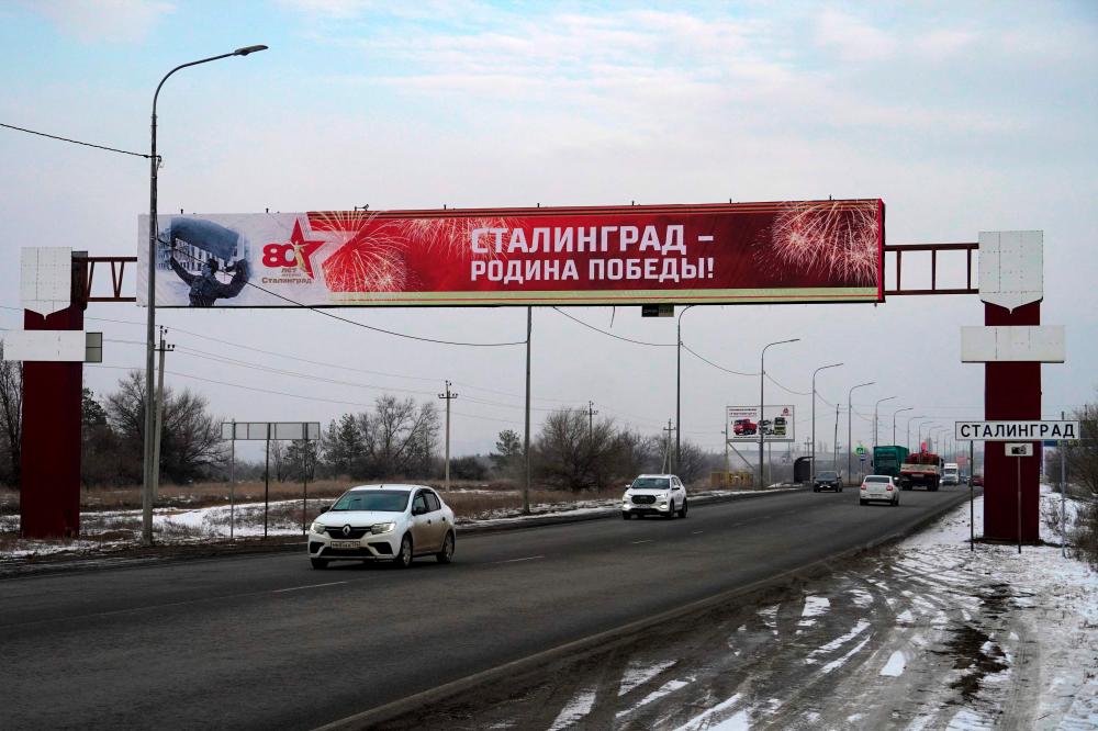 A road sign reading “Stalingrad” sits on the side of a road entering the Russian southern city of Volgograd (former Stalingrad) on January 31, 2023, after authorities temporarily replaced signs as part of celebrations marking the 80th anniversary of the Stalingrad Battle. AFPPIX