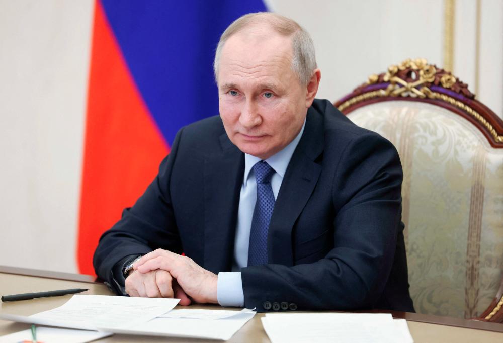 Russian President Vladimir Putin chairs a meeting on the social and economic development of Crimea and Sevastopol via a video link at the Kremlin in Moscow on March 17, 2023. - AFPPIX