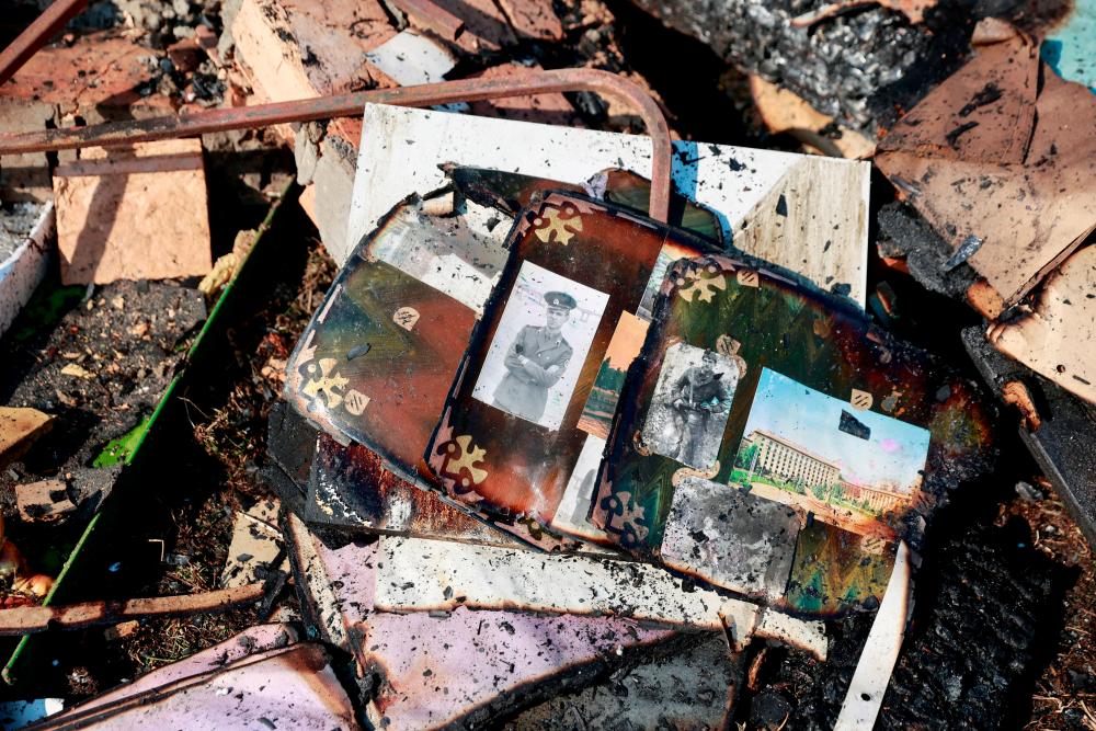 Pictures lie amidst the rubble of former teacher Natalia's house which was was hit in a military strike, amid Russia's invasion of Ukraine, in Kyiv/REUTERSPix