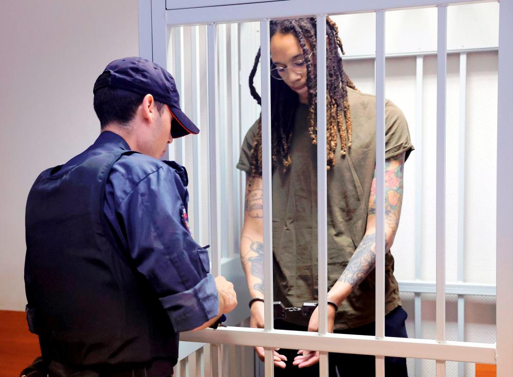 US basketball player Brittney Griner stands in a defendants' cage before a court hearing during her trial on charges of drug smuggling, in Khimki, outside Moscow on August 2, 2022. AFPPIX