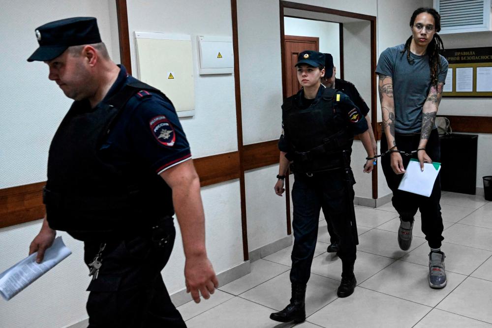 US Women's National Basketball Association (NBA) basketball player Brittney Griner, who was detained at Moscow's Sheremetyevo airport and later charged with illegal possession of cannabis, leaves the courtroom after the court's verdict in Khimki outside Moscow, on August 4, 2022. AFPPIX