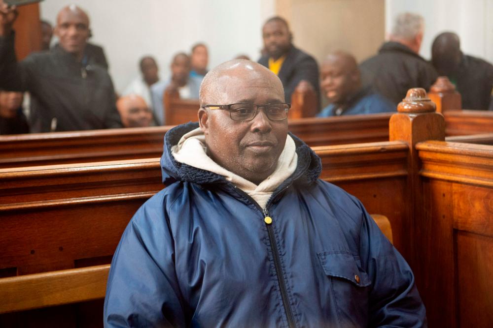 Fulgence Kayishema, one of the last fugitives sought for their role in the 1994 Rwanda genocide, sits in the Cape Town Magistrate’s Court in Cape Town on May 26, 2023, two days after being arrested following 22 years on the run. AFPPIX
