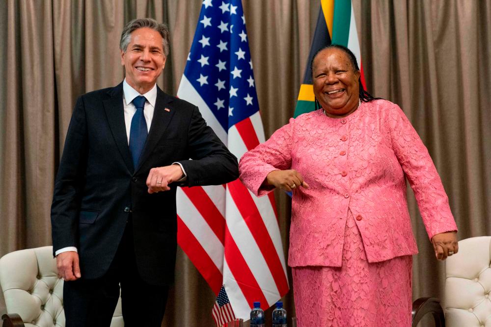 US Secretary of State Antony Blinken (L) is greeted by South Africa’s Foreign Minister Naledi Pandor (R) as he arrives for a meeting at the South African Department of International Relations and Cooperation in Pretoria, South Africa, on August 8, 2022. AFPPIX