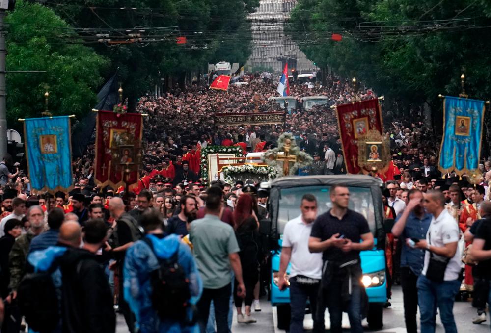 People attend a mass prayer dedicated to 18 people who were killed in two shootings in Serbia earlier in the month, in Belgrade, on May, 25, 2023. AFPPIX