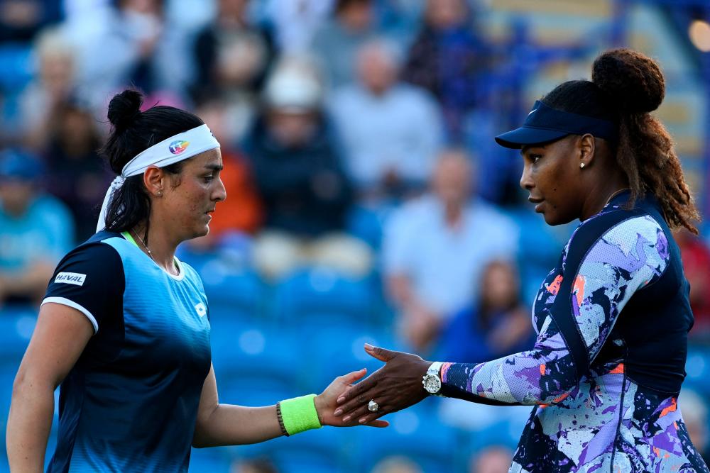 Serena Williams of the US (R) and Tunisia's Ons Jabeur react as they play against Japan's Shuko Aoyama and Tawain's Chan Hao-ching during their women's doubles quarter final tennis match on day four of the Eastbourne International tennis tournament in Eastbourne, southern England on June 22, 2022. AFPpix