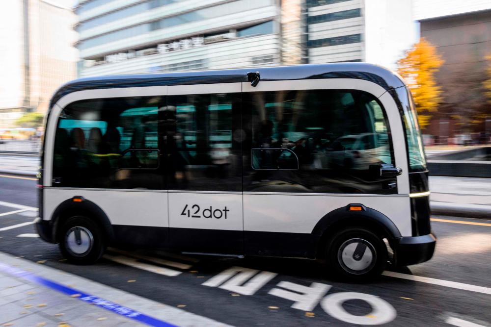 In this photo taken in Seoul on November 23, 2022, a bus leaves its stop on the country’s first self-driving bus route run by 42 Dot, a start-up owned by South Korea’s Hyundai which created the automomous driving technology. AFPPIX