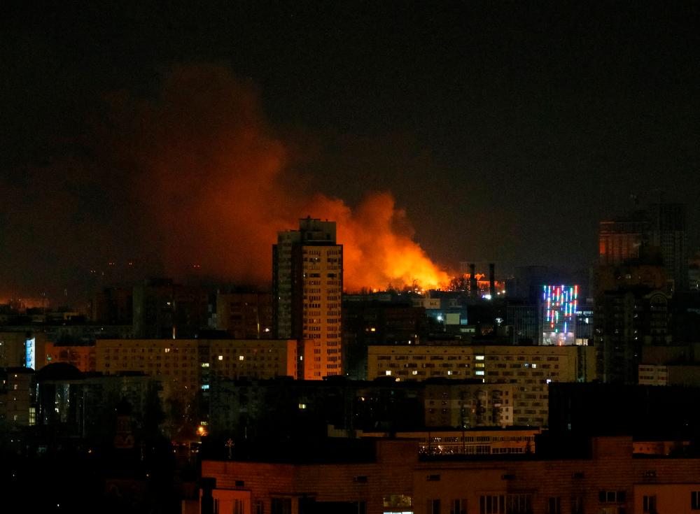 Smoke and flames rise over during the shelling near Kyiv, as Russia continues its invasion of Ukraine/REUTERSPix