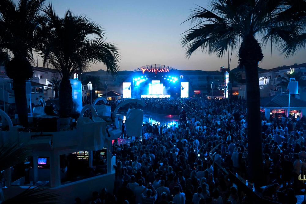 People party at the Ushuaia nightclub in Ibiza, on June 17, 2022. After being closed for two years because of the Covid-19 pandemic, the Mediterranean island’s famous mega-clubs have reopened their doors, drawing throngs of partygoers. AFPPIX