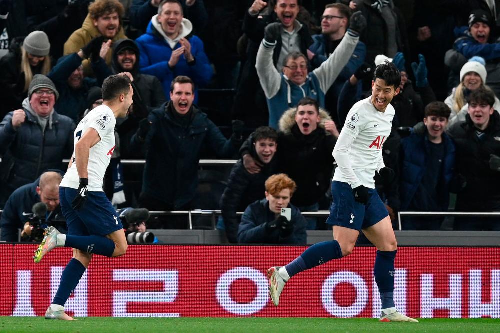 Tottenham Hotspur's South Korean striker Son Heung-Min (R) celebrates after scoring their second goal during the English Premier League football match between Tottenham Hotspur and Brentford at Tottenham Hotspur Stadium in London, on December 2, 2021. AFPpix