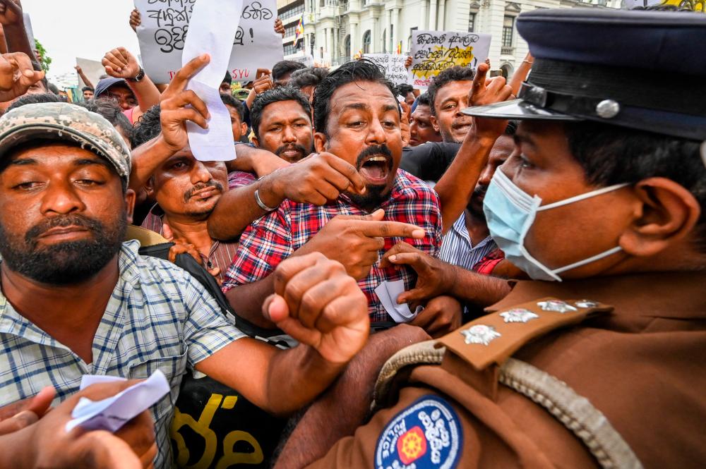 Protestors take part in an anti-government demonstration outside the Sri Lanka police headquarters in Colombo on May 16, 2022. AFPPIX
