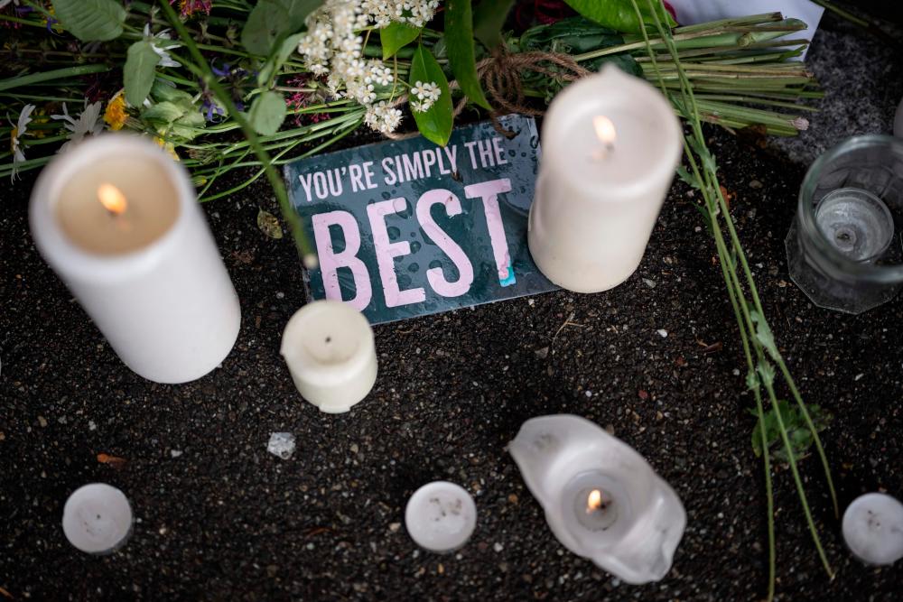 Candles and a message are seen layed outside the estate of late singer Tina Turner following the announcement of her death, in Kusnacht on May 25, 2023. AFPPIX