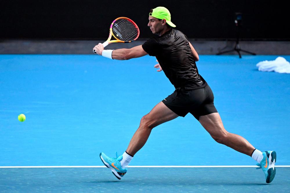 Spain's Rafael Nadal hits a return during a practice session ahead of the Australian Open tennis tournament in Melbourne on January 12, 2023. - AFPPIX