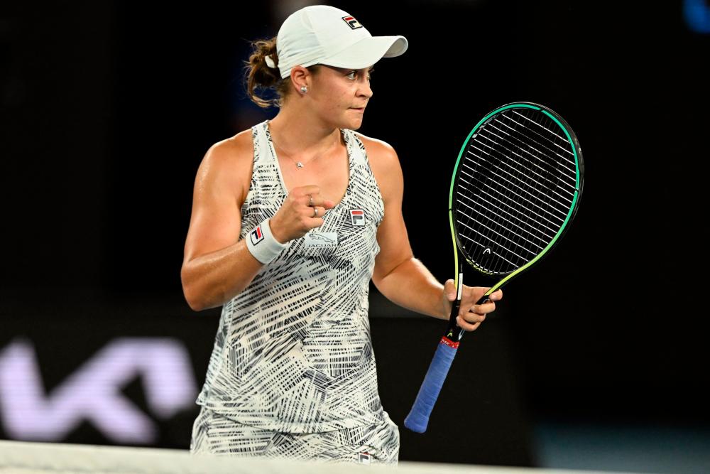 Australia’s Ashleigh Barty celebrates after beating Madison Keys of the US in their women’s singles semi-final match on day eleven of the Australian Open tennis tournament in Melbourne on January 27, 2022. AFPPIX