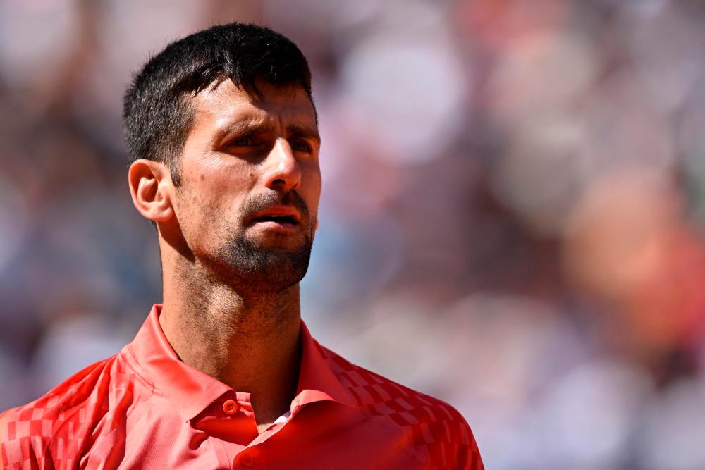 Serbia’s Novak Djokovic looks on as he plays against US Aleksandar Kovacevic during their men’s singles match on day two of the Roland-Garros Open tennis tournament at the Court Philippe-Chatrier in Paris on May 29, 2023/AFPPix