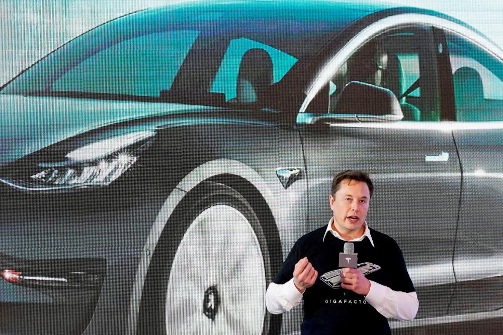 Musk speaking during a delivery event for Tesla China-made Model 3 cars at its factory in Shanghai in January 2020. He said in an interview published yesterday that the Covid-19-related shutdowns in Shanghai ‘were very, very difficult’. REUTERSpix