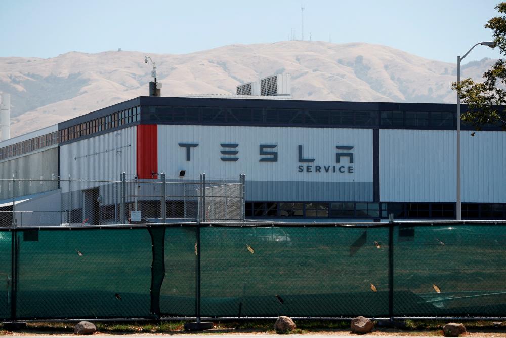 The Tesla factory in Fremont, California. Tesla needs to deliver more than 450,000 vehicles in the fourth quarter to meet its goal of growing deliveries by 50% annually. – Reuterspix
