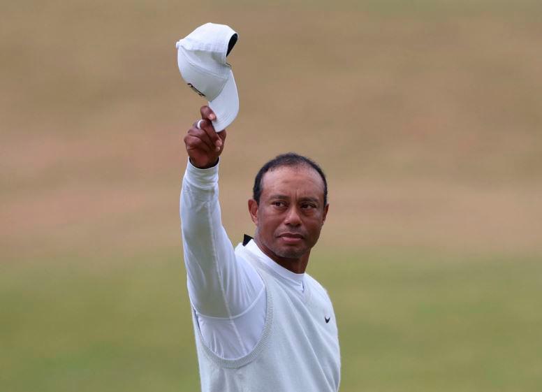 Golf - The 150th Open Championship - Old Course, St Andrews, Scotland, Britain - July 15, 2022 Tiger Woods of the U.S. acknowledges the fans after holing on the 18th and finishing his second round REUTERSPIX
