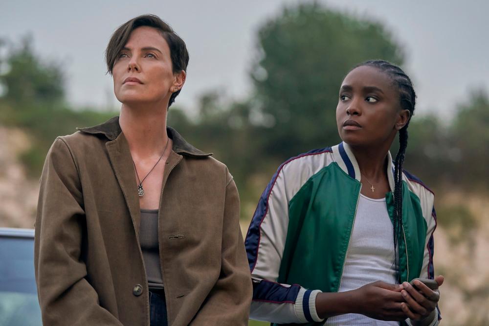 $!Charlize Theron (left) and KiKi Layne in ‘The Old Guard’. – Netflix