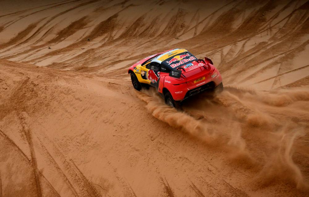 BRX’s French driver Sebastien Loeb and Belgian co-driver Fabian Lurquin compete during Stage 8 of the Dakar 2023 between Al Duwadimi and Riyadh, Saudi Arabia, on January 8, 2023/AFPPix