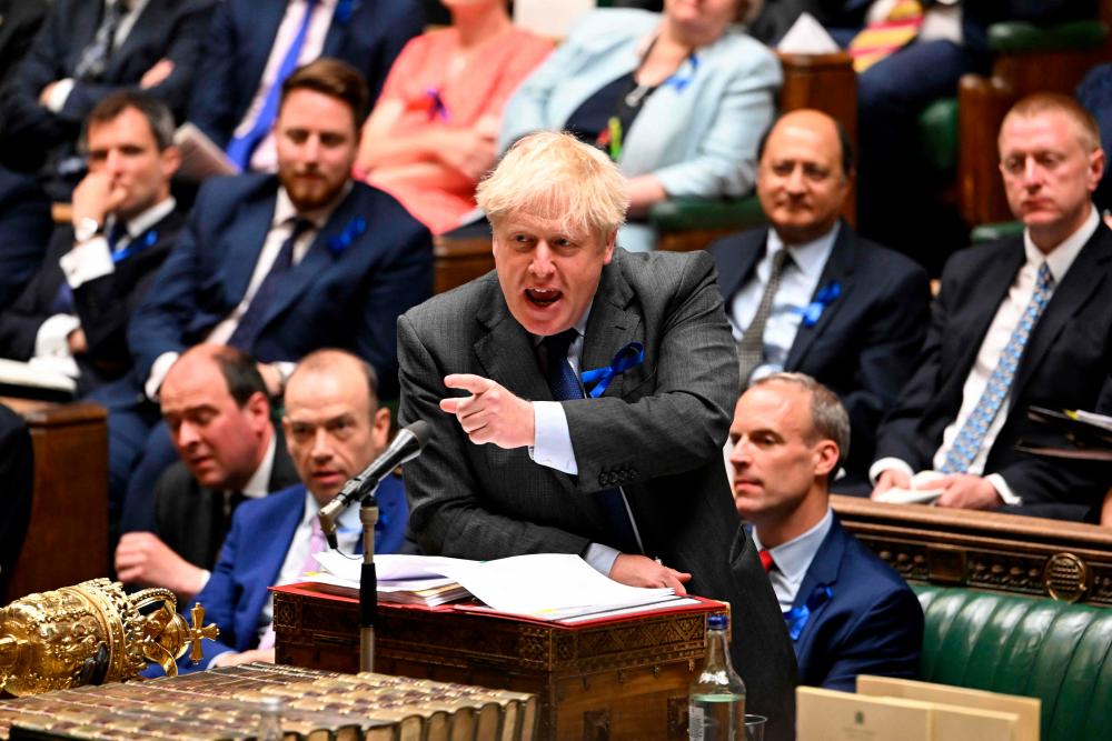 A handout photograph released by the UK Parliament shows Britain’s Prime Minister Boris Johnson gesturing as he speaks during the weekly Prime Minister’s Questions (PMQs) session in the House of Commons, in London, on June 22, 2022. AFPPIX