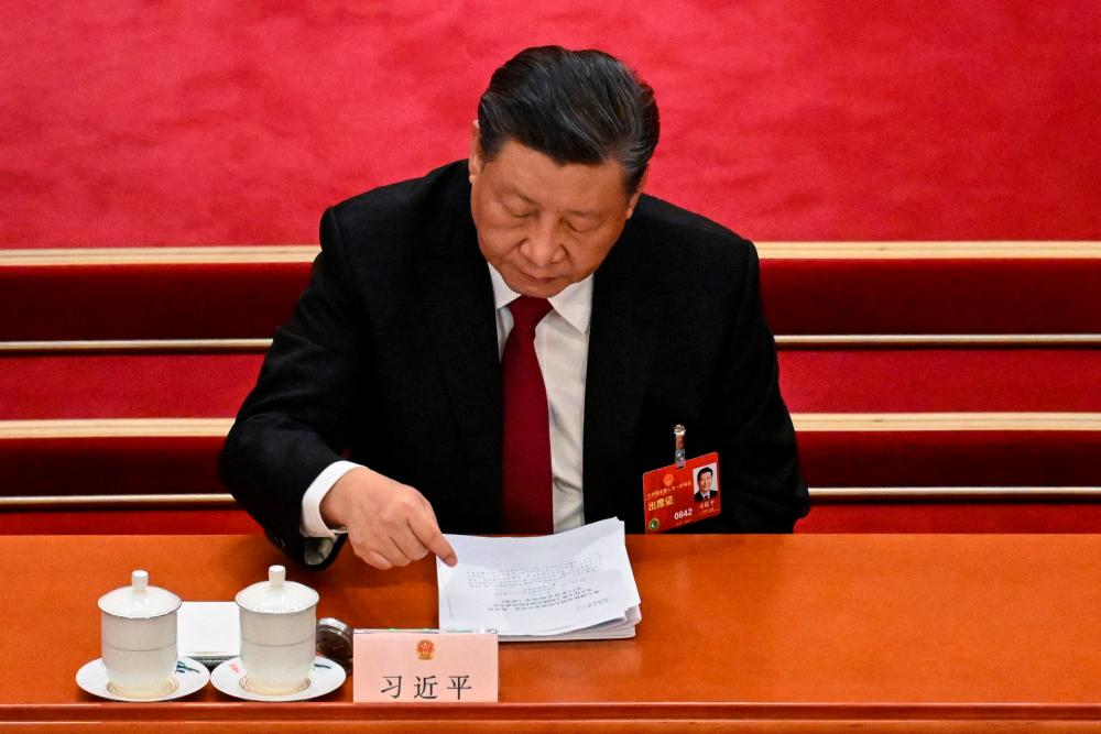 China's President Xi Jinping attends the opening session of the National People's Congress (NPC) at the Great Hall of the People in Beijing on March 5, 2023. AFPPIX