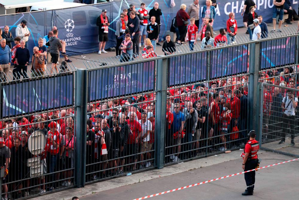 Liverpool fans stand outside prior to the UEFA Champions League final football match between Liverpool and Real Madrid at the Stade de France in Saint-Denis, north of Paris, on May 28, 2022. AFPPIX