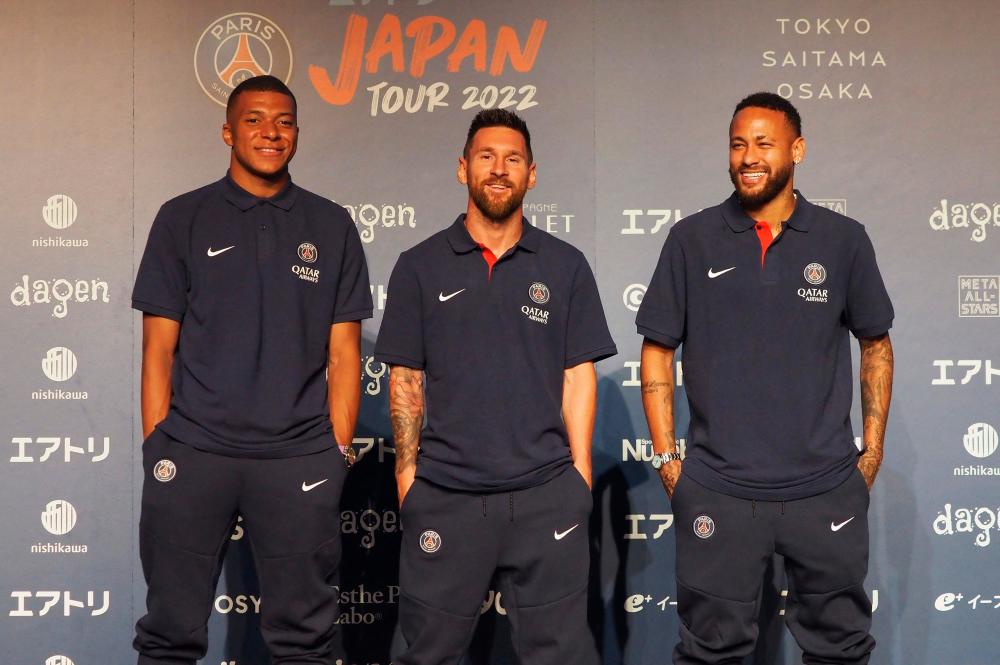 Paris Saint-Germain’s (L-R) French forward Kylian Mbappe, Argentinian forward Lionel Messi and Brazilian forward Neymar pose during a press conference in Tokyo on July 17, 2022. AFPPIX