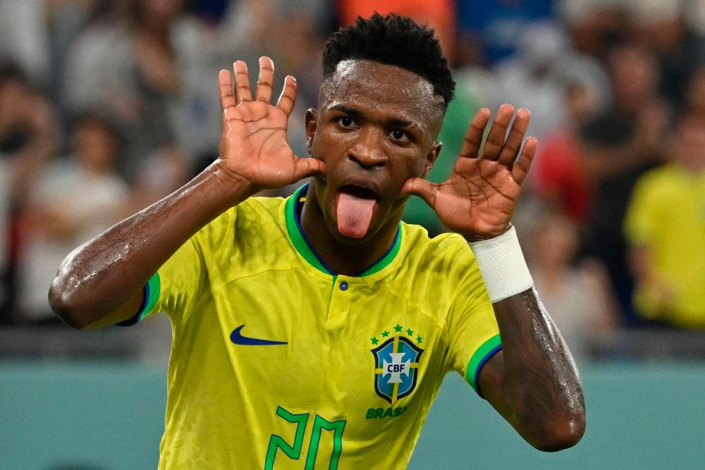 Brazil’s forward #20 Vinicius Junior celebrates after he scored a goal which was disallowed during the Qatar 2022 World Cup Group G football match between Brazil and Switzerland at Stadium 974 in Doha on November 28, 2022. AFPPIX