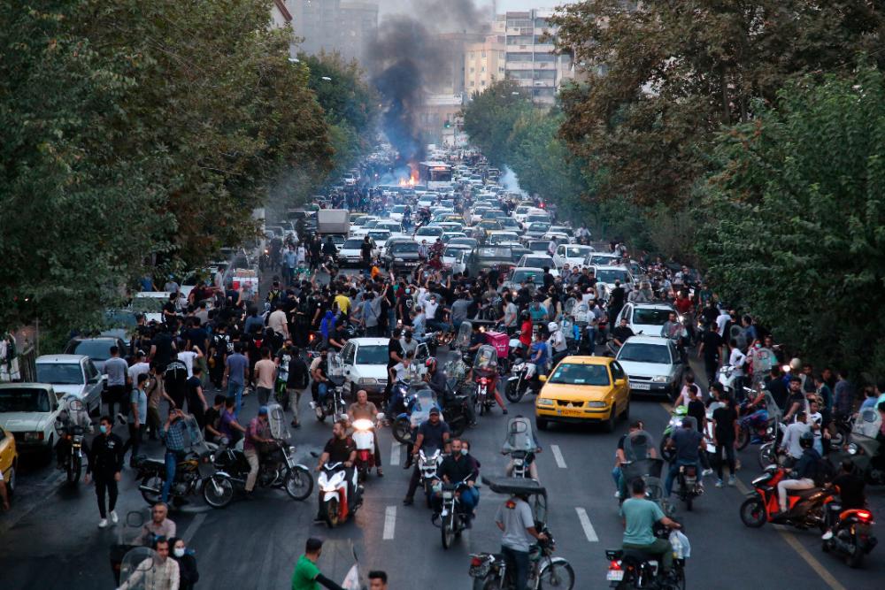 A picture obtained by AFP outside Iran on September 21, 2022, shows Iranian demonstrators taking to the streets of the capital Tehran during a protest for Mahsa Amini, days after she died in police custody/AFPPix
