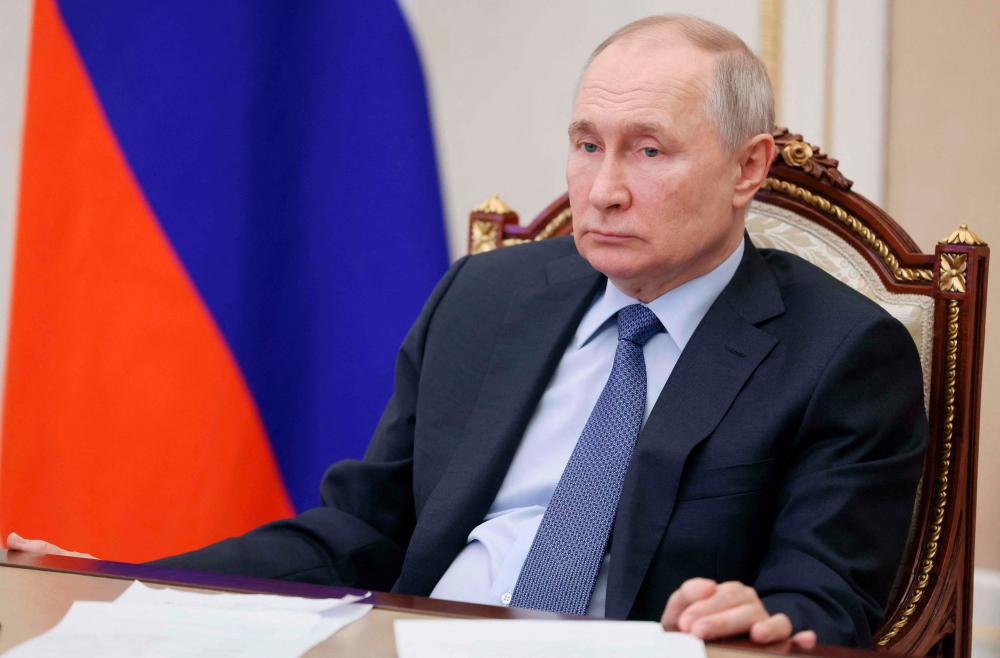 Russian President Vladimir Putin chairs a meeting on the social and economic development of Crimea and Sevastopol via a video link at the Kremlin in Moscow on March 17, 2023. AFPPIX