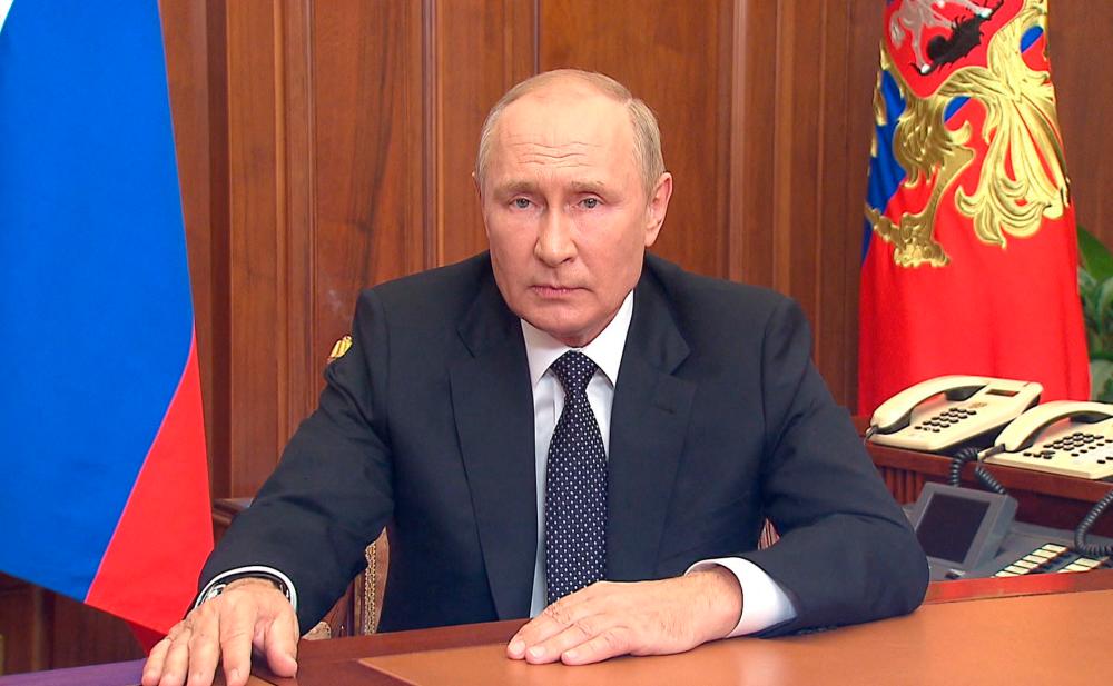 This handout picture released on September 21, 2022 by the Kremlin shows Russian President Vladimir Putin speaking during a televised address to the nation in Moscow. AFPPIX