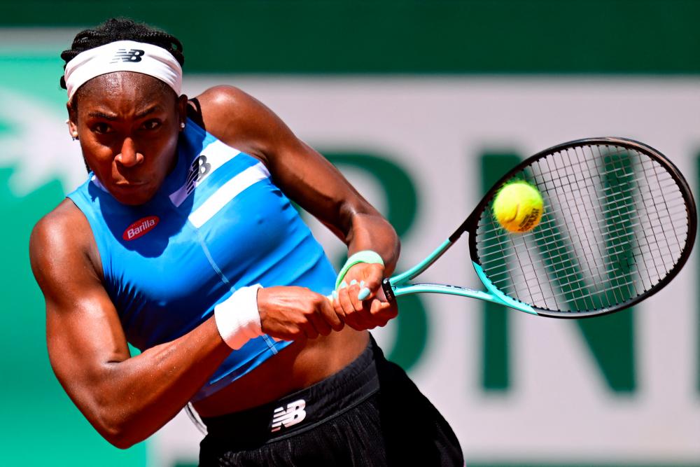 US Coco Gauff plays a backhand return to Russia’s Mirra Andreeva during their women’s singles match on day seven of the Roland-Garros Open tennis tournament at the Court Suzanne-Lenglen in Paris on June 3, 2023/AFPPix