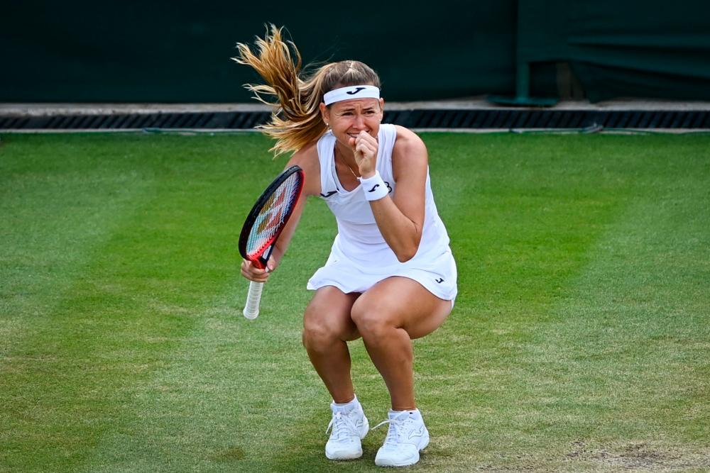 Czech Republic’s Marie Bouzkova celebrates after winning against France’s Caroline Garcia at the end of their round of 16 women’s singles tennis match on the seventh day of the 2022 Wimbledon Championships at The All England Tennis Club in Wimbledon, southwest London, on July 3, 2022. AFPPIX