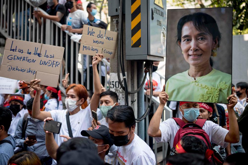 A protester holds an image of detained civilian leader Aung San Suu Kyi during a demonstration outside the Embassy of Myanmar in Bangkok on February 1, 2023, to mark the second anniversary of the coup in Myanmar. AFPPIX