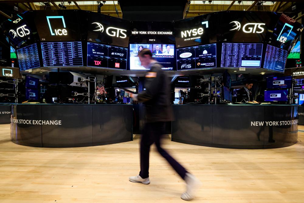 Traders working on the floor of the New York Stock Exchange on Tuesday, March 28, 2023. – Reuterspic