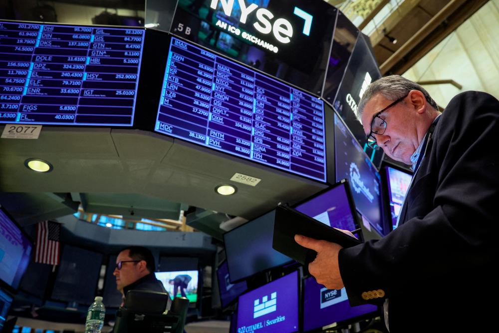 Traders working on the floor of the New York Stock Exchange on Wednesday, March 29, 2023. – Reuterspic