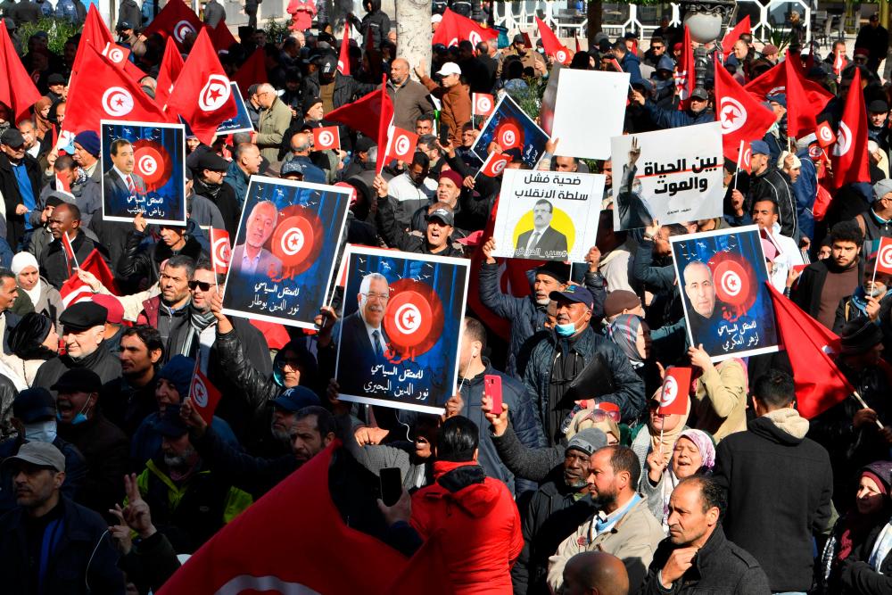 People take part in a demonstration in Tunis on March 5, 2023, in defiance of a protest ban, demanding the release of prominent figures opposed to the president who were arrested in recent weeks. AFPPIX