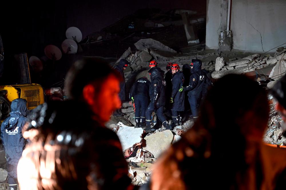 Rescue personnel search for victims and survivors through the rubble of buildings in Kahramanmaras, Turkey, after a 7.8-magnitude earthquake struck the country’s southeast on February 7, 2023. AFPPIX