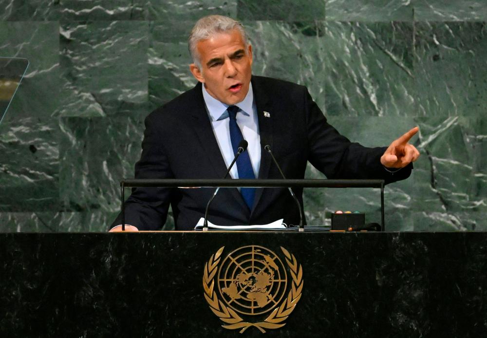 Israel’s Prime Minister Yair Lapid addresses the 77th session of the United Nations General Assembly at the UN headquarters in New York City on September 22, 2022. AFPPIX