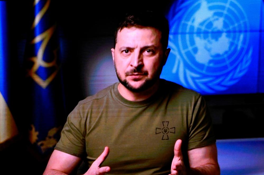 Ukrainian President Volodymyr Zelensky is seen on a screen as he remotely addresses the 77th session of the United Nations General Assembly at the UN headquarters in New York City on September 21, 2022. AFPPIX