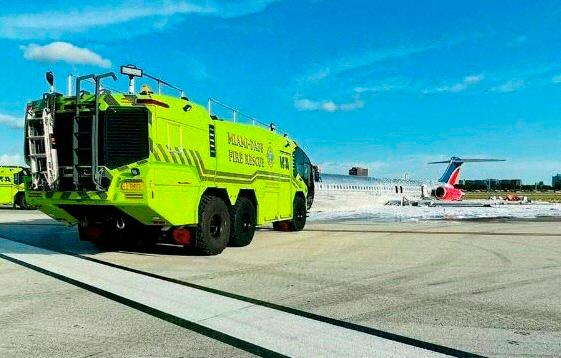 A handout picture provided by the Miami-Dade Fire Rescue shows a Red Air jet after catching fire while landing at Miami International Airport on June 22, 2022 in Miami, Florida. Investigators were headed to Miami Wednesday after a passenger jet’s landing gear collapsed and it caught fire as it landed at the US city’s international airport, authorities said. AFPPIX