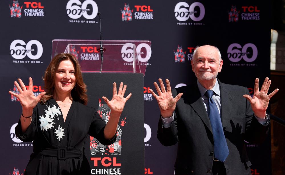 James Bond producers Michael Wilson (R) and Barbara Broccoli take part in their Hand and footprint ceremony at TCL Chinese Theatre in Hollywood, California, on September 21, 2022. AFPPIX